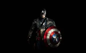 Captain America stands tall and proud in the dark night. 