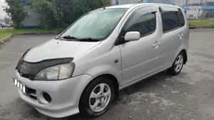  Caption: Compact Elegance - Daihatsu YRV 2000 