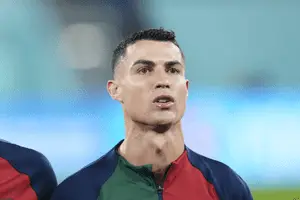 Cristiano Ronaldo poised for action on the football field.
