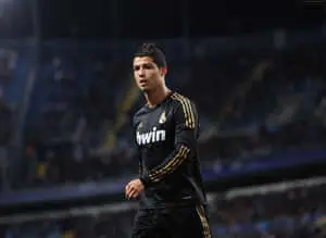 Cristiano Ronaldo takes the ball down the pitch during a soccer match