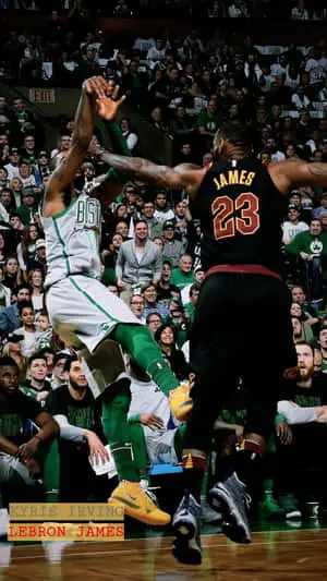 Kyrie Irving holding the latest iPhone