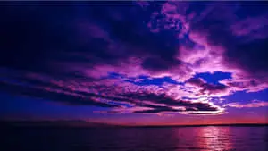 Majestic Purple Sunset over Scenic Landscape
